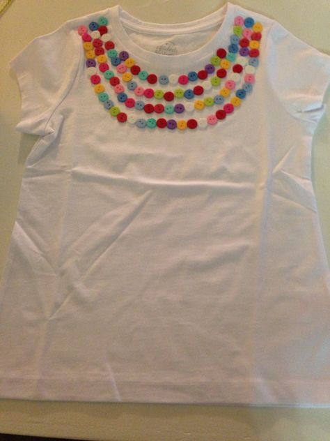 100 Days of School shirt: Be sure to put a layer of wax paper inside your clean shirt before you get started! Arrange 100 colorful buttons and secure with Aleene's Fabric Glue. Allow 24 hours to dry, 48 before washing inside out. Super cute! Dot Day Shirt Ideas Kids, International Dot Day Shirt, 120th Day Of School, Quiet Bags, Dot Day Shirt, 100 Day Shirt Ideas, First Grade Crafts, 100 Day Of School Project, 100 Days Of School Shirt