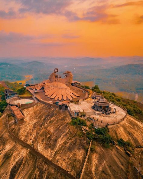 Jatayu Earth's Center in Kerala is a unique tourist destination known for its giant bird sculpture and adventure activities. Located in Chadayamangalam, it offers zip-lining, rock climbing, and trekking. For travel details, you can reach there by road from Trivandrum (about 50 km) or Kochi (about 160 km). There are also public transport options available. It's advisable to check the latest transportation options and timings before planning your trip. . . . . #ngtindia #keralatourism #jatayu #... Kerala Travel, Rock Sculpture, Thiruvananthapuram, Kerala Tourism, Beautiful Images Nature, Bird Sculpture, Adventure Activities, Travel Packages, Kochi