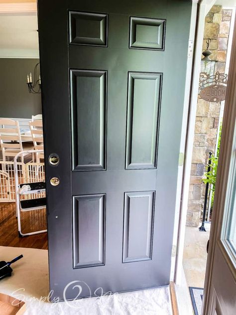 Is your front door looking a little drab? Want to make a good first impression? Come see how we updated our front entry with a simple and affordable front door makeover. #frontdoor #blackdoor #entryway #frontporch #diy #makeover #painteddoor Painting A Steel Entry Door, Front Door Upgrade Diy, Diy Front Door Makeover Ideas, Builder Grade Front Door Makeover, Front Door Replacement Before And After, Black Paint For Front Door, Paint Front Door Black, Redo Front Door, Front Door Update Diy