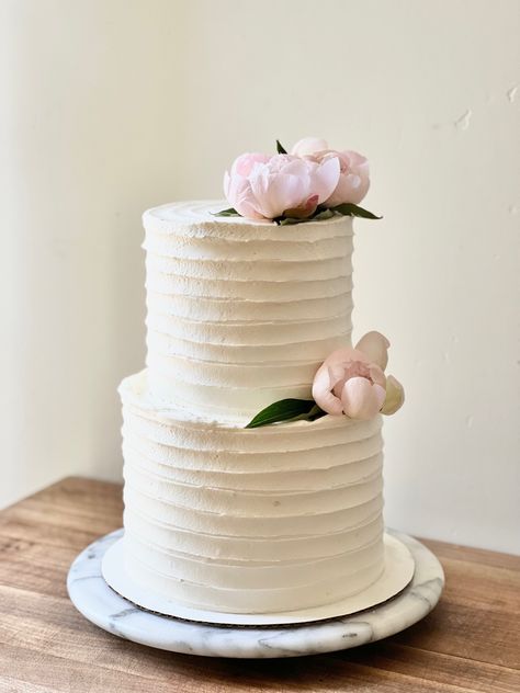 Two tier Fluffy white vanilla wedding cake with vanilla swiss merengue buttercream and pink peonies Two Tier Bridal Shower Cake, Wedding Cake Vanilla, White Birthday Cakes, White Buttercream, Two Tier Cake, Bridal Shower Cake, White Wedding Cakes, White Wedding Cake, White Cake