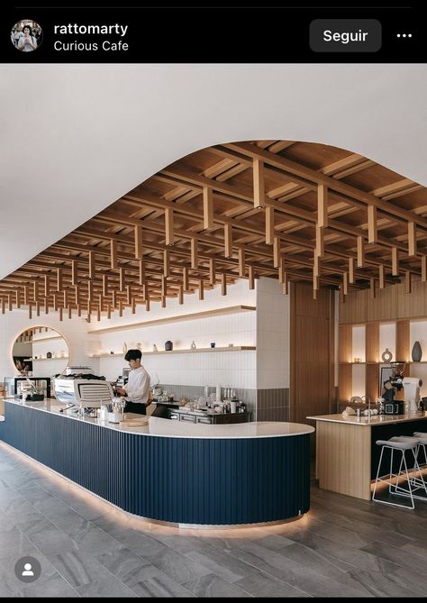 Long Bar Design, Restaurant Ceiling Design Cafe Interiors, Trendy Store Design, Curved Cafe Counter, Cafe Island Counter, Coffee Shop Ceiling Design, Cafe Ceiling Ideas, Scandinavian Cafe Interior, Cafe Concept Ideas