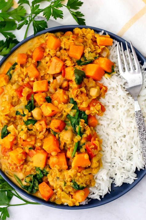 This butternut squash and chickpea curry is quick and easy to make, yet bursting with flavor and filled with healthy veggies and plant-based protein. Tender red lentils simmered with spices, tomatoes, spinach, chickpeas, and roasted butternut squash in a creamy coconut milk sauce! Butternut Squash Slow Cooker, Coconut Milk Sauce, Butternut Squash Spinach, Butternut Squash Stew, Savory Butternut Squash, Tomato Lentils, Butternut Squash Kale, Lentil Curry Recipes, Butternut Squash Curry