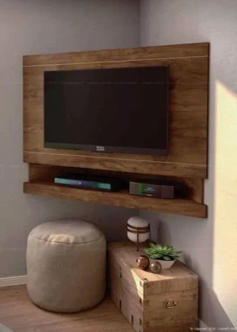 This corner wooden TV stand is suitable for small spaces or apartments.

#CreativeTVStands
#DIYMediaConsoles
#UniqueEntertainmentUnits
#InnovativeTVStandDesigns
#QuirkyHomeFurniture
#FunkyTVStandIdeas
#OutoftheBoxTVStands
#UnconventionalMediaStorage
#EccentricLivingRoomDecor
#OffbeatEntertainmentCenters Corner Tv Shelf, Diy Corner Tv Stand, Corner Tv Ideas, Tv Stand Inspiration, Portable Tv Stand, Unique Tv Stands, Tv Stand Ideas, Wooden Tv Stand, Large Tv Stands