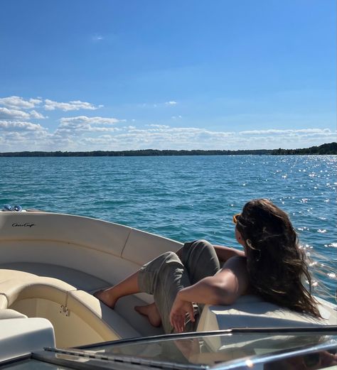 a girl is seated in a speedboat. she looks out over the water. Sleeping On A Boat, Speed Boat Photoshoot, Speedboat Aesthetic, Speed Boat Aesthetic, Boating Aesthetic, Sailing Aesthetic, Boat Photoshoot, African Couture, Boat Girl