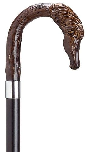 Crook Horse Head Cane Imported from Italy, the horse head crook handle with simulated brown tone finish is made of high impact durable nylon and mounted stylishly on a black lacquered hardwood shaft set off smartly with a silver tone metal ring. The shaft is 36 inches long and tapers from 7/8 inch to 3/4 inch in diameter. Replacement tip #8039808. Manufactured in the USA. 36 inches is the standard length. We can also customize the length to suit your height by choosing one of our available sizes Carved Walking Sticks, Hand Carved Walking Sticks, Canes And Walking Sticks, Cane Stick, Stick Horses, Wooden Canes, Wooden Walking Sticks, Walking Sticks And Canes, Canes & Walking Sticks