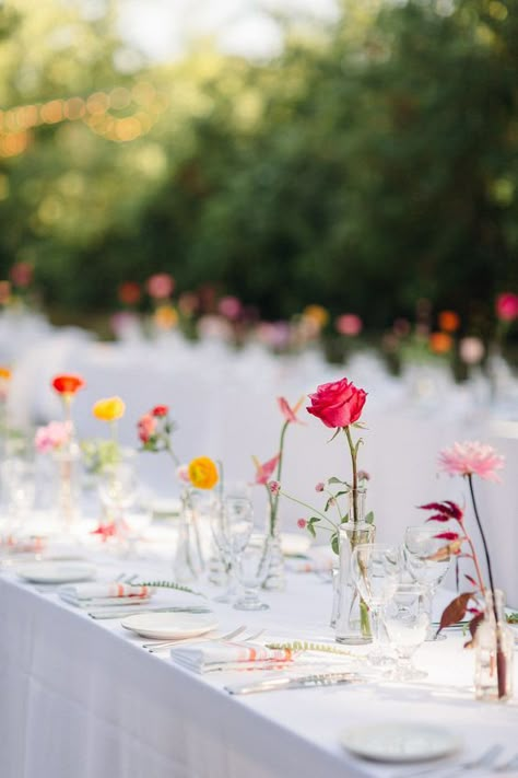 Spring Flower Bud Vases, Spring Wedding Must Haves, One Flower Vase Wedding, Scattered Flowers On Table, Wildflower Cocktail Hour, Teal Wildflower Wedding, Individual Flowers In Vases, Bud Vases Bright Flowers, Backyard Bridal Shower Set Up