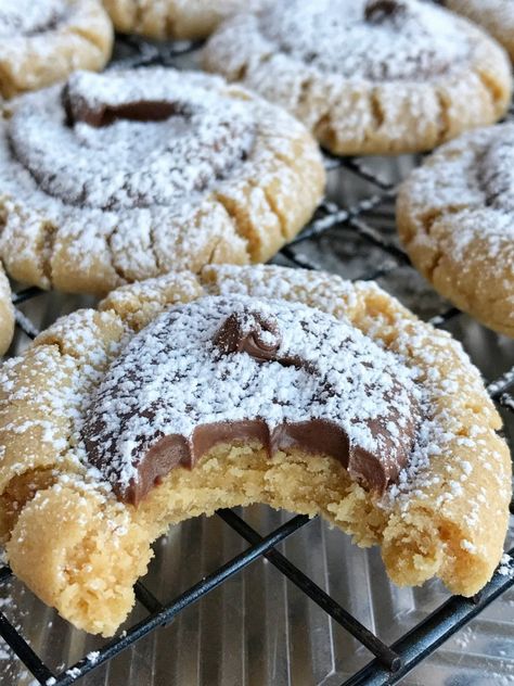 Muddy Buddy Peanut Butter Cookies | Your favorite snack made into a cookie! Muddy buddy peanut butter cookies are a soft & thick peanut butter cookie with a chocolate center, and dusted in powdered sugar. Perfect dessert or even better for a Christmas cookie plate. These may look hard but they are really very simple! www.togetherasfamily.com #christmascookies #peanutbuttercookies #peanutbutterrecipes #recipe Muddy Buddy Cookies, Peanut Butter Muddy Buddies, Brownie Vegan, Muddy Buddy, Stick Butter, Melting Chocolate Chips, Xmas Cookies, Cookies Recipes Christmas, Cookies Ingredients