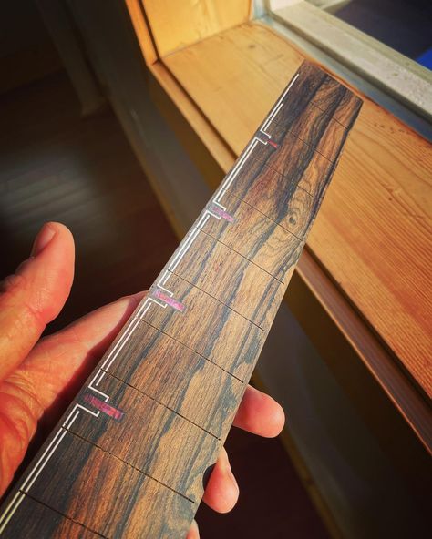 Tyler Robbins on Instagram: “Ziricote fretboard with purple resin fret markers. 🤖: @frettiemercury #wood #woodworking #music #likes #art #woodart #woodporn…” Fret Markers, Guitar Inlay Design, Art Guitar, Fretboard Inlay, Guitar Inlay Fretboard, Bass Guitar Art, Ukulele Design, Guitar Studio, Guitar Inlay