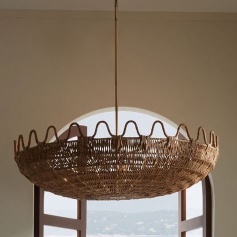 Laura kirar’s playfully theatrical natural lampakanay rope is woven into palm forms – as seen with mar floor lamp and mar pendant chandelier - call to mind the classic era of the 1930’s in the coastal south of france. Held together by an iron rod finished in antique brass. Kirar pays homage to the details of casually curated mediterranean interiors with their influences of aged formal furniture, the micro-climate combinations of tropical plants and pines, the passion for all things exotic from c Kitchen Chandelier Island, All Of The Lights, Arteriors Home, Chandelier Bedroom, Ranch Style Home, Ranch Style, Pendant Chandelier, South Of France, Coastal Style