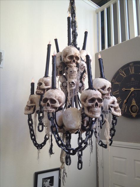 Skeleton Chandelier.. Made with old vintage chandelier spray painted black with styrofoam skulls and PVC candles added Bone Chandelier Diy, Skull Chandelier Diy, Styrofoam Skull Crafts, Shipwreck Halloween, Skeleton Furniture, Chandelier Spray, Bone Chandelier, Skeleton Chandelier, Skull Chandelier