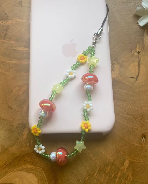 Mushroom phone strap just listed 🍄🍄 #beadedphonestrap #mushroomcharm #phonebeads #mariobros Mushroom Phone Charm, Aesthetic Phone Strap, Phone Straps Beads Ideas, Diy Phone Strap, Phone Strap Aesthetic, Diy Phone Charms, Phone Charm Beads, Aesthetic Phone Charms, Phone Charms Aesthetic