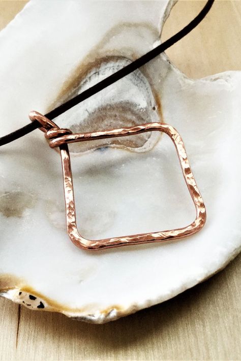 Handmade Copper Diamond Shaped Pendant on Leather Cord. With it's cool and simple design, this copper pendant necklace is a great boho minimalist piece. The Bohemian yet refined look of the hammered copper is effortlessly cool and perfect for everyday looks, the unique hammered copper design catches the light for a subtle sparkle. Click through to view this and other designs. #copperjewelry #bohojewelry #coppernecklace Copper Design, Electroformed Jewelry, Hammered Copper, Handmade Jewelry Designs, Pretty Bracelets, Unique Handmade Jewelry, Handmade Copper, Copper Pendants, Diamond Pendant Necklace