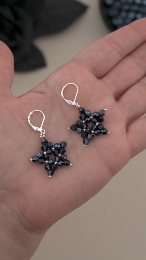 DIY Beaded Star Earrings with Crystal Bicone, Seed Beads and Thread: Easy Beading Idea 💀 Perfect for: Halloween costumes, gothic fashion!   Halloween Craft Ideas: Easy Beaded Earrings for Costumes | DIY Witchy Earrings Design!  👇 For Longer Version Watch Earring Design#10 From this Video: https://youtu.be/Dg7q1rqFTlU?si=sV3MLyolkG4jQnuK  ✨ Materials Used:  4mm Black Crystal Bicone Beads 11/0 Miyuki Silver Seed Beads 6lb Fireline Beading Thread Lever back Earring Hooks Needle Diy Earrings With Beads, Earring Design Ideas, Homemade Beads, Simple Earring Designs, Easy Beading, Gothic Jewelry Diy, Anting Manik, Witchy Earrings, Earrings With Beads