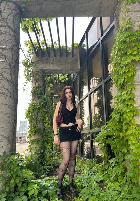 Seen in picture: -Black Dark Academia Grunge Halter Vest -Y2K 2000s Dark Academia Preppy Black Denim Mini Skirt -Heart fishnet tights -Platform Doc Martens sandals -2000s blood red leather purse #y2k #y2kfashion #2000s #2000sfashion #fairygrunge #summer2023 #haltervest #miniskirt Mini Skirt Outfit With Tights, Skirt Outfit With Tights, Black Denim Mini Skirt Outfit, Sandals 2000s, Rockstar Girlfriend Outfit, Doc Martens Sandals, Outfit With Tights, Denim Mini Skirt Outfit, Dark Academia Grunge