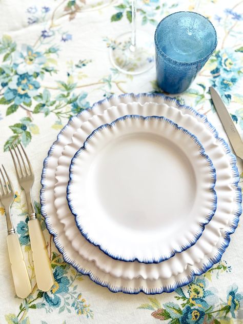 We hunted high and low for the talented maker of these gorgeous ruffle plates. Truly the Prima ballerina of all plates, we are so pleased to be able to offer this sophisticated and energetic collection to our clients. Made entirely by hand in a small atelier in France, the Prima plates will be a forever favorite. Ruffle Charger Ceramic Blue Edge Plate- 11.8" Dishwasher safe. These chargers are made by our expert artisans in France - Please allow 6-8 weeks for delivery, if pieces are not stocked Anthropologie Plates, Small Kitchen Ideas On A Budget, Serving Bowls Ceramic, Painted Kitchen Tables, Blue And White Dinnerware, Small Atelier, Prima Ballerina, Blue Napkins, Cerámica Ideas