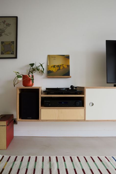 Within a Barbican apartment, we custom-made the sideboard to each speaker’s exact dimensions, making sure the surface top would be flush with the top of the record player. The main challenge was to hide the wires, creating a fuss-free, minimalist look and feel. 

Perhaps our favourite touch - adding handles from an old storage cupboard within the apartment. We cleaned and polished each signature, circular handle, adding 50 years of history to a piece of Lozi furniture. Minimalistic Tv Wall Design, Barbican Apartment, Living Room Speakers, Plywood Sideboard, Diy Kast, Camera Studio, Record Player Cabinet, Brick Cottage, Media Units