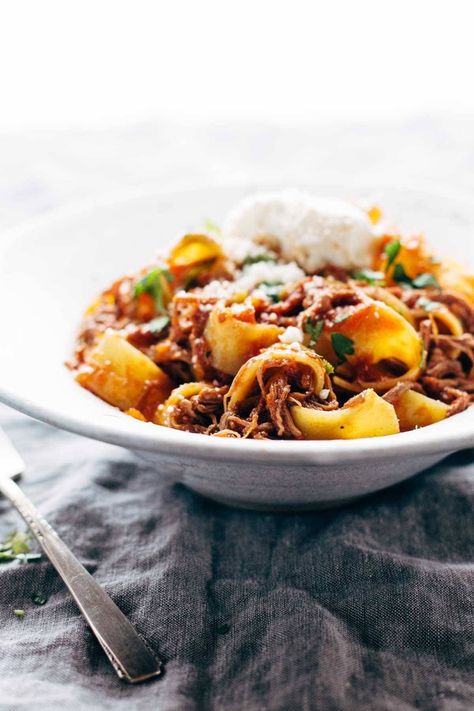 Slow Cooker Beef Ragu with Pappardelle! We're making this cozy, comforting Beef Ragu with Pappardelle! Steak is braised in the crockpot for hours with garlic, tomatoes, veggies, and herbs, then shredded and piled high on pappardelle with Parm cheese. #ragu #beef #pasta Slow Cooker Beef Ragu, Ragu With Pappardelle, Beef Ragu, Pappardelle Pasta, Beef Pasta, Flank Steak, Slow Cooker Beef, Beef Broth, Ricotta