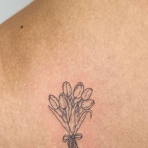 sam- nyc fineline tattoo artist on Instagram: "📍nyc- books are open! dm to book/inquire 🫶🏼dainty, cute, fineline, and pet portrait tattoos  a sweet little custom tulip bouquet for the lovely @kxssvo 💐💐  tysmmm💕  @helloinknyc 🤗  #daintytattoo #floraltattoos #tulip #nyctattoo #finelinetattoos" Dainty Linework Tattoo, Spine Tattoos For Women Tulips, Small Tulip Bouquet Tattoo, Vintage Tulip Tattoo, Bunch Of Tulips Tattoo, Vase Of Tulips Tattoo, Mini Bouquet Tattoo, Three Tulip Tattoo, Tulip And Sunflower Tattoo