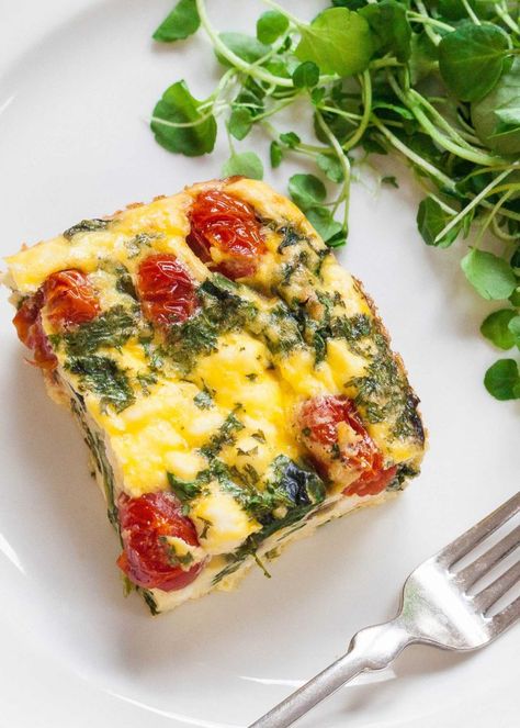 Frittata Squares with Spinach, Tomatoes, and Feta Recipe | SimplyRecipes.com Tomatoes And Feta Cheese, Tomato Frittata, Tomato And Feta, Tomatoes And Feta, Spinach Tomato, Queso Feta, Frittata Recipes, Spinach And Cheese, Spinach And Feta