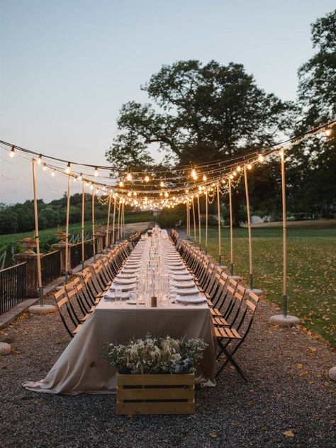 an al fresco dinner setting with a ceiling of fairy lights over a long table in a bohemian style decor Extra Long Table, White And Gold Dress, Beneath The Stars, 30th Birthday Bash, Al Fresco Dinner, Bohemian Chic Decor, Dinner Setting, Bohemian Outdoor, Outdoor Dinner Parties