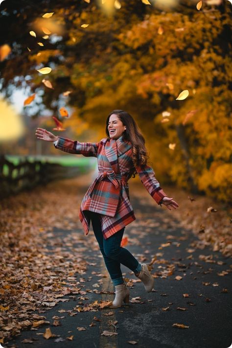 Woman in plaid fall coat tossing leaves Autumn Photography Portrait, Australia Pictures, Autumn Woman, Fall Portraits, Fall Coats, Tongue Tie, Stylish Photo Pose, Fall Photoshoot, Wallpaper Iphone Christmas