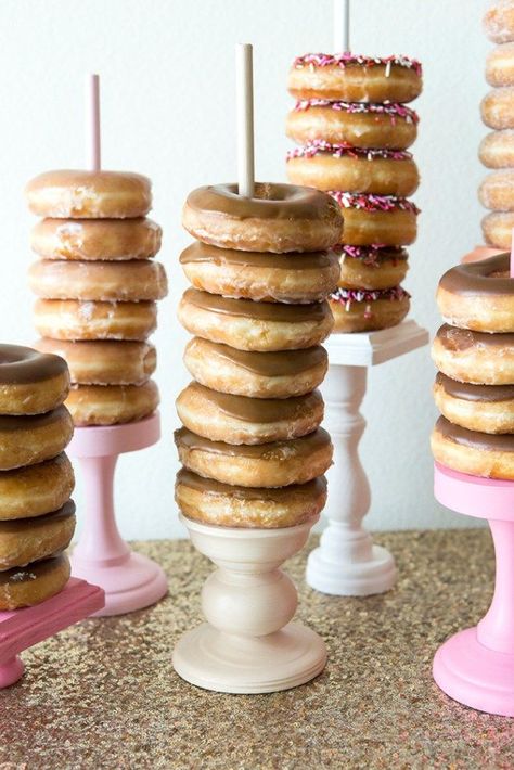 Donut bar- all different sizes of candle stick holders (painted white and copper) with a different flavor donut on each Wedding Donut Dessert Table, Wedding Donut Bar, Donut Dessert Table, Donut Stands, Donut Bar Wedding, Donut Display, Donut Stand, Wedding Donuts, Donut Dessert