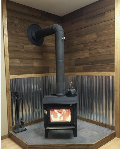 Corrugated Tin Fireplace, Snowy Cabin Aesthetic Interior, Woodstove Backdrop Ideas, Corrugated Metal Wood Stove, Coal Stove Ideas Living Rooms, Pellet Stove Basement, Woodstoves Ideas, Corner Pellet Stove Mantle, Metal Behind Wood Stove