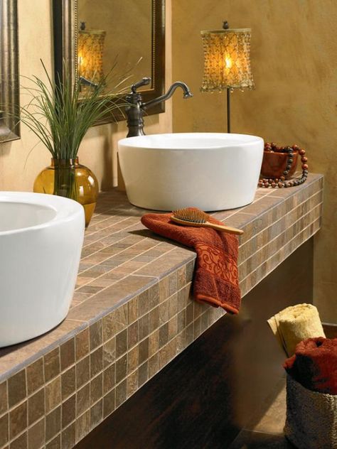 Ideal for busy baths, tile is resistant to heat, impervious to water and easy to clean. Tiled Countertop Bathroom, Unique Vanity, Granite Bathroom, Ceramic Tile Bathrooms, Tile Counters, Outdoor Kitchen Countertops, Tile Remodel, How To Install Countertops, Cheap Bathrooms