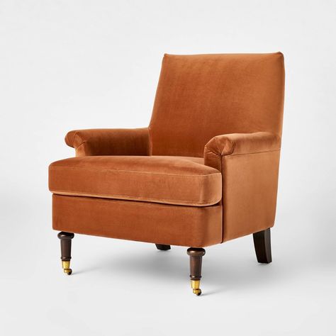 Add luxurious style to your interior decor with the Mercer Upholstered Active Sitting Accent Chair with Casters from Threshold™ designed with Studio McGee. This rust-colored accent piece features an upholstered design which complements your space while adding comfort. The four brown legs boast a rounded design with gold-tone detailing on the front legs for a stunning look. Crafted from a wooden frame, this accent chair has curved arms, making it a beautiful addition to your space. Plus, it comes Mid Century Modern Upholstered Chair, Chesterfield Accent Chair, Target Chairs Living Room, Burnt Orange Accent Chair, Two Accent Chairs In Living Room, Terracotta Chair, Burnt Orange Chair, Academia Apartment, Faculty Office