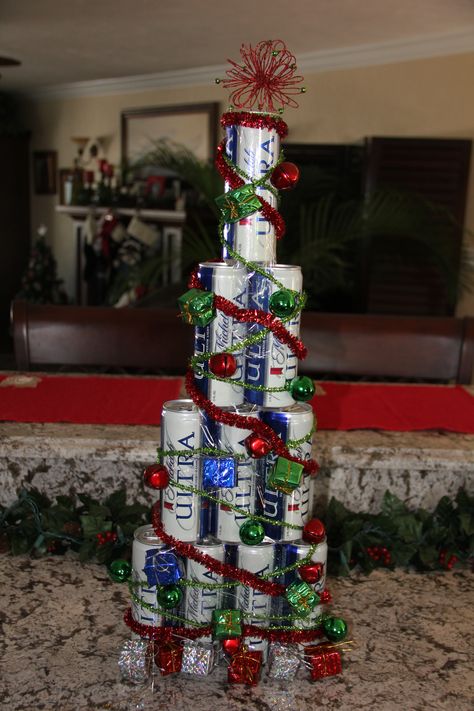 I created this Christmas Tree out of full cans of beer for a friend of mine.  I used clear packing tape and decorated it.  She loved it! The sky is the limit on ideas!  Can't wait to see what everyone can create!  Great man gift for XMas and attach lottery tix, favorite candy, gift cards, etc! Beer Can Christmas Tree, Can Christmas Tree, Decorated Trees, Bangs Ideas, Haircut 2022, Christmas Tree With Presents, Easy Diy Christmas Gifts, Tree Themes, Pixie Cut With Bangs