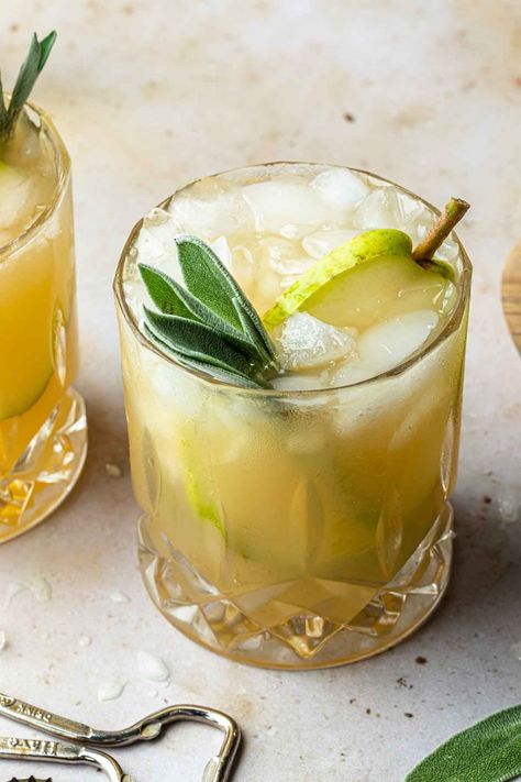 This cozy bourbon pear cocktail features bourbon, sage-infused simple syrup, pear nectar and lime juice topped with crisp ginger beer. It's an incredible way to enjoy the under-appreciated flavors of fall. Bourbon Sidecar, Apple Martinis, Candy Corn Jello, Irish Mule, Candy Corn Jello Shots, Pear Cocktail, Pear Nectar, Ginger Beer Cocktail, Bourbon Cocktail Recipe