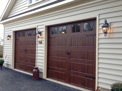 Clopay Gallery Collection steel garage doors with short rectangular windows. www.clopaydoor.com Brown Garage Door, Faux Wood Garage Door, Garage Door House, Garage Door Maintenance, Garage Door Windows, Wooden Garage Doors, Carriage House Garage, Garage Door Company, Garage Door Types