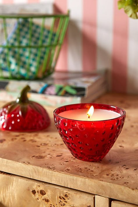 A berry sweet addition to your space, our Strawberry Candle is infused with entrancing scents that will fill your space with welcoming appeal. Housed in a glass strawberry-shaped vessel that can reused for storage once your candle is burned. Available exclusively at Urban Outfitters. Scents Strawberry Gelato: citrus, strawberry, frost, strawberry, raspberry, cheesecake, vanilla, sugar, cream, almond Nirvana: citrus, nectar, patchouli, jasmine, wood, tobacco, vanilla Withered Rose Petals: raspber Strawberry Gelato, Withered Rose, Strawberry Candle, Strawberry Kitchen, Strawberry Decorations, Cute Candles, Raspberry Cheesecake, Vanilla Sugar, Cute Home Decor