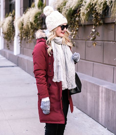 A good #jacket is a huge investment. I can see why so many people wear this brand! A white pom #beanie with a red puffer #CanadaGoose #winter #coat! Click here for more detail on the best winter coat. Visions of Vogue blog Red Winter Jacket Outfit, Maroon Puffer Jacket Outfit, Winter Coat Outfits Casual, Red Jacket Winter, Burgundy Puffer Jacket, Red Jacket Outfit, Uggs Outfit Winter, Winter Hat Outfit, Snow Fits