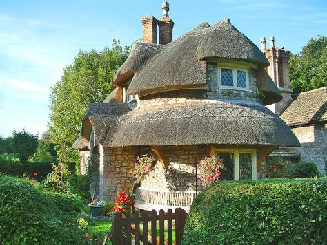 Cottage at Blaise Hamlet, Bristol    Now owned by the National Trust, the hamlet is an exquisite group of nine picturesque thatched cottages round a green. They were built in 1811 for pensioners of the Blaise Estate. Round Cottage, Fairy Tale Cottage, Cute Cottages, European Cottage, Storybook Homes, Thatched House, Little Cottages, Small Cottages, Fairytale Cottage