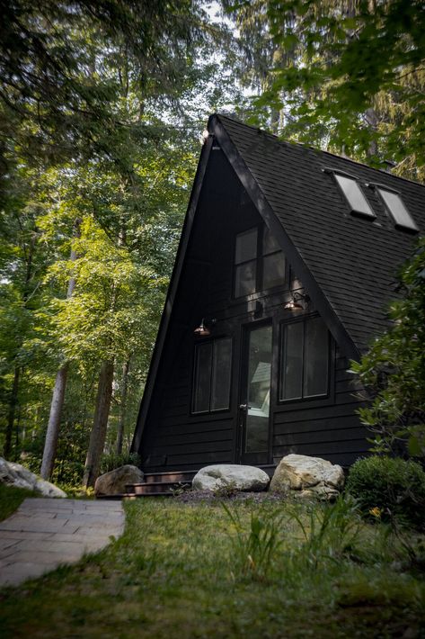 Front of the A-frame Tagged: Exterior, Wood Siding Material, Cabin Building Type, Concrete Siding Material, A-Frame RoofLine, Shingles Roof Material, and Glass Siding Material. Photo 15 of 16 in Lakeview A-frame by Peishan Stinnett. Concrete Siding, Valley Cottage, Spa Bathtub, Frame Cabin, A Frame Cabin, A Frame House, Wood Siding, Mountain House, Stone Flooring