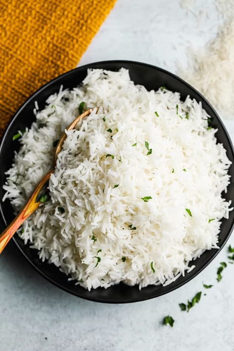 Learn how to cook perfect Basmati Rice on the stove, in a rice cooker, or in the Instant Pot. Soft, flavorful, and tender, it’s the best rice to serve with tikka masala, in burritos, or with your favorite curry recipe! Best Basmati Rice, Perfect Basmati Rice Stovetop, How To Cook Basmati Rice On The Stove, How To Cook Basmati Rice, Best Basmati Rice Recipe, Basmati Rice Recipes Easy, Coconut Basmati Rice, Rice Recipes Easy, Food For Guests