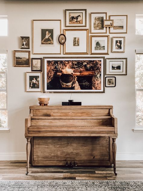 Gallery wall display with Samsung Frame TV Frame Tv Over Piano, Piano Gallery Wall, Picture Frame Tv Gallery Wall, Gallery Wall Above Piano, Gallery Wall With Frame Tv, Tv Over Piano, Desk Gallery Wall, Gallery Wall Around Tv, Gallery Wall Antique