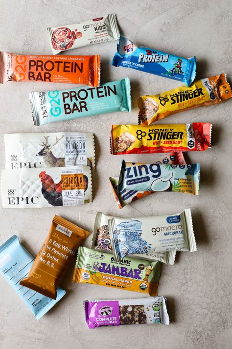 We’re helping you cut through the mass of options by sharing our favorite protein bars we’ve vetted, as a team of registered dietitians, and enjoyed over the years. While we haven’t tasted every single protein bar out there, we have tasted quite a few. Here’s what we recommend, based on taste, nutrition, ingredients, certifications, and protein quality. Healthiest Protein Bars, Best Protein Bars To Buy, Best Protein Bars For Women, Protein Bar Brands, Clean Protein Bars, Dietitian Recipes, Healthy Protein Bars, Best Protein Bars, Gluten Free Bars