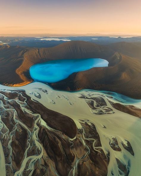 Iurie Belegurschi on Instagram: "Crater lake and glacial rivers in the majestic highlands of Iceland 🇮🇸 #iceland #guidetoiceland #photography" Black Sand Desert, Iceland Photos, Crater Lake, Iceland Travel, Black Sand, Down Jackets, Hunting Fishing, Blue Water, Wild Animals