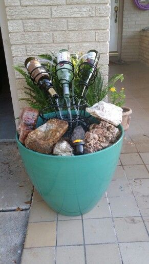 Patio wine bottle water fountain. | #WaterFeatures #ContainerWaterGardens Wine Bottle Fountain, Bottle Fountain, Wine Bottle Craft, Bottle Craft Ideas, Container Water Gardens, Diy Water Feature, Old Wine Bottles, Diy Water Fountain, Diy Garden Fountains