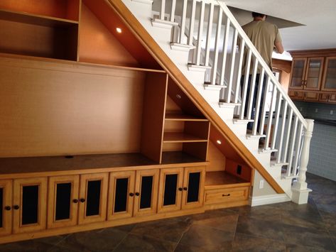 Solution for Open Space under Staircase: This is double sided with entertainment center on one side and book/linen storage on the other. Design Under Stairs, Living Room Under Stairs, Interior Design Under Stairs, Cabinet Under Stairs, Room Under Stairs, Space Under Stairs, تحت الدرج, Staircase Storage, Loft Storage