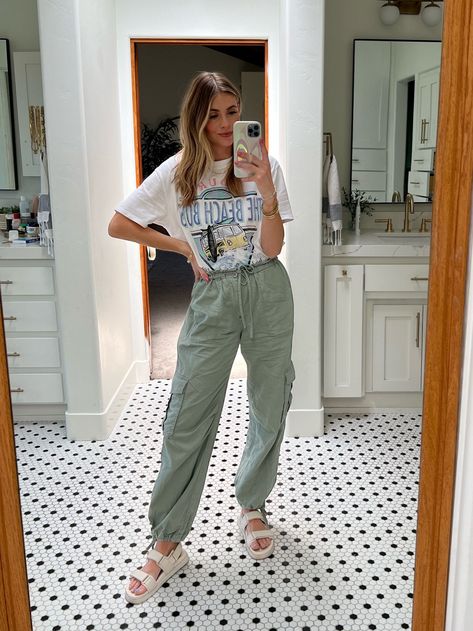 This was my look for a day full of baseball games and in and out for lunch. I love these green cargo pants from Abercrombie and paired it with this graphic t-shirt, also from Abercrombie, and these white strappy sandals. You can find everything via the link here! | outfit, style, looks, fashion, inspiration, ideas, mom life, mom style, wardrobe, cargo pants, graphic t-shirt, sandals Cargo Pants With Sandals, Ootd Navy, Mom Style Inspiration, White Strappy Sandals, Us Fashion, Green Cargo Pants, Mama Style, Green Cargo, Popular Fashion