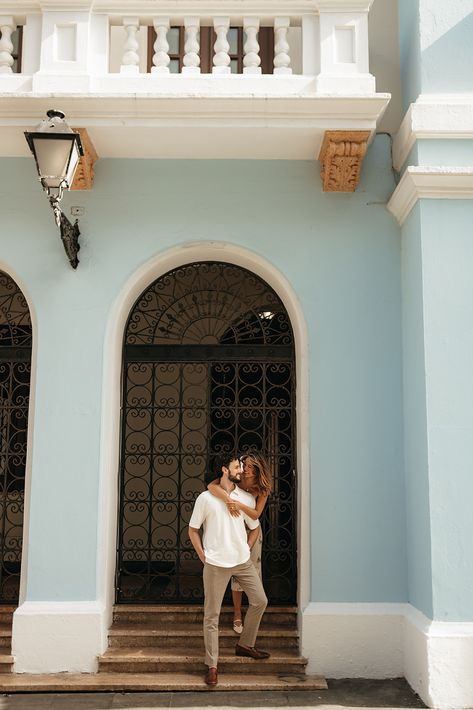 Stephanie is behind Greg with her arms around him, they're standing on steps under an Old San Juan arch. Puerto Rico Couples Photoshoot, San Juan Photoshoot, San Juan Engagement Photos, Puerto Rico Couple Pictures, Jaipur Prewedding, Photoshoot Moodboard, Proposal Pictures, Engagement Pic, Proposal Photography