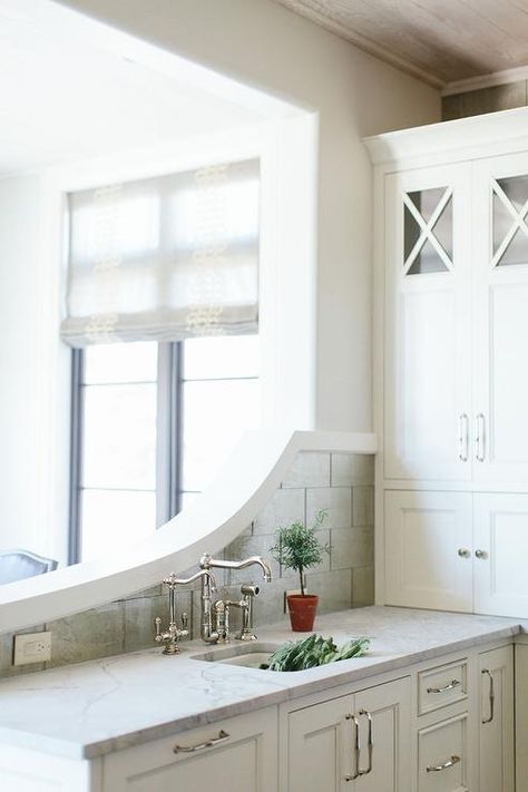 Kitchen peninsula with curved backsplash Overlooking Living Room, Beveled Subway Tile Backsplash, White Beveled Subway Tile, Paneled Refrigerator, White Subway Tile Kitchen, Beveled Subway Tile, Delta Trinsic, Kate Marker Interiors, Kitchen Peninsula