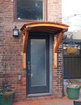 Curved cedar awning - craftsman - Spaces - Toronto - Brendan Fenn. FromHouzz Cedar Awning, Porch With Pergola, Prefab Cabin Kits, Window Pergolas, Wooden Shingles, Awning Over Door, Front Door Overhang, Craftsman Home Decor, Front Door Awning