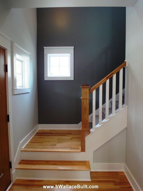 blue/gray accent wall on the wood stoves wall....this will help make the furniture make sense. Living Room Paint Color Ideas With Accent Wall Stairs, Accent Wall Staircase Paint Colors, Stair Wall Painting Ideas, Accent Wall Staircase, Staircase Accent Wall, Wall Staircase, Wood Stove Wall, Painted Staircases, Grey Accent Wall