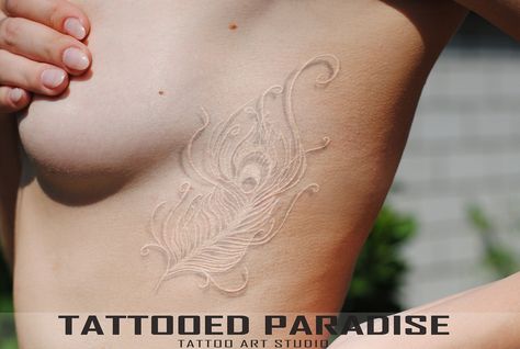 White Feather Tattoos, Tattoo Finger, Mastectomy Tattoo, Tattoo Beautiful, White Tattoos, Paradise Tattoo, Peacock Feather Tattoo, Peacock Tattoo, White Ink Tattoo