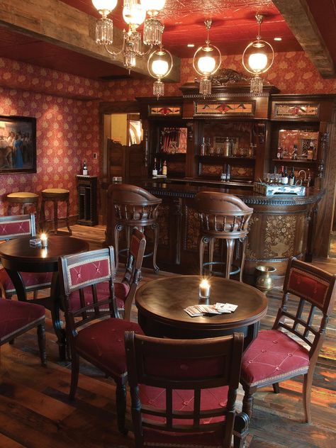 The D and D Saloon boasts a vintage bar. Burnt red keeps with the Old West theme. The custom back of the bar is fitted with a hidden karaoke screen to help struggling singers. Barn Bar, Saloon Bar, Saloon Decor, Old West Saloon, Victorian Bar, Western Bar, Western Interior, Western Saloon, Pub Interior