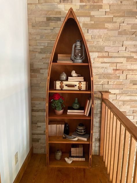 How sweet is this little canoe bookshelf?! 🛶 Need help styling the perfect #shelfie? We can help! . . . #style #shopping #love #shop #discount #boutique #shoplocal #design #beautiful #musthave #winter #shopsmall #jewelry #vintage #dreamhome #oldhomes #newbuild #renovation #antique #character #lakelife #hcnh #designfurnish #design #furnish #canoe #bookshelf Canoe Bookshelf, Upcycle Bookshelf, Boat Bookshelf, Living Room Cottagecore, Canoe Shelf, Boat Furniture, Baby 2024, Bookcase Makeover, Cabin Ideas